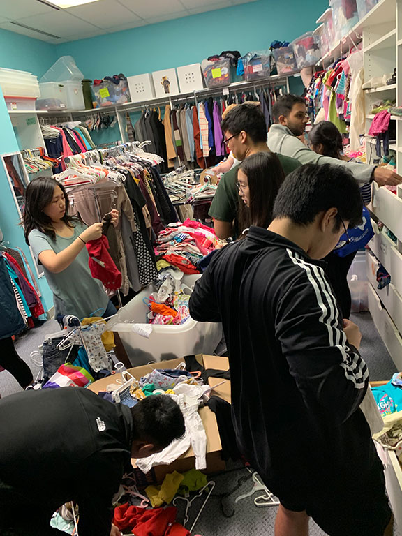 volunteers sorting donated clothes